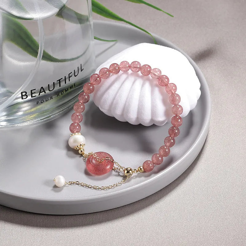 Women's Korean style crystal bracelet showing options with jade pendant or coloured stone safety buckle.