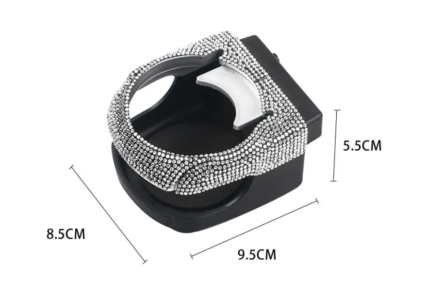 White diamond-decorated car cup holder bracket clipped onto a vehicle air vent.