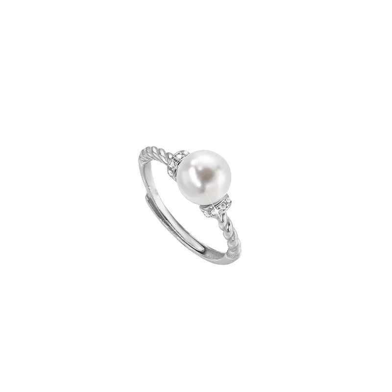 Adjustable antique twist copper ring with geometric pearl inlay in gold and silver colours.
