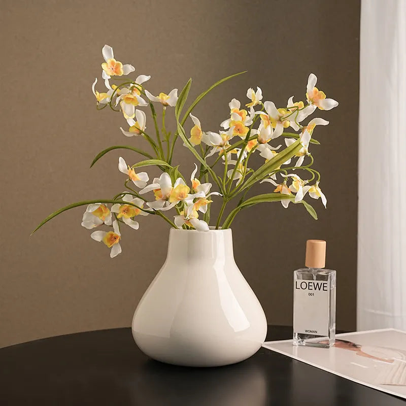 Round belly ceramic vase in black or white with optional artificial flowers arrangement