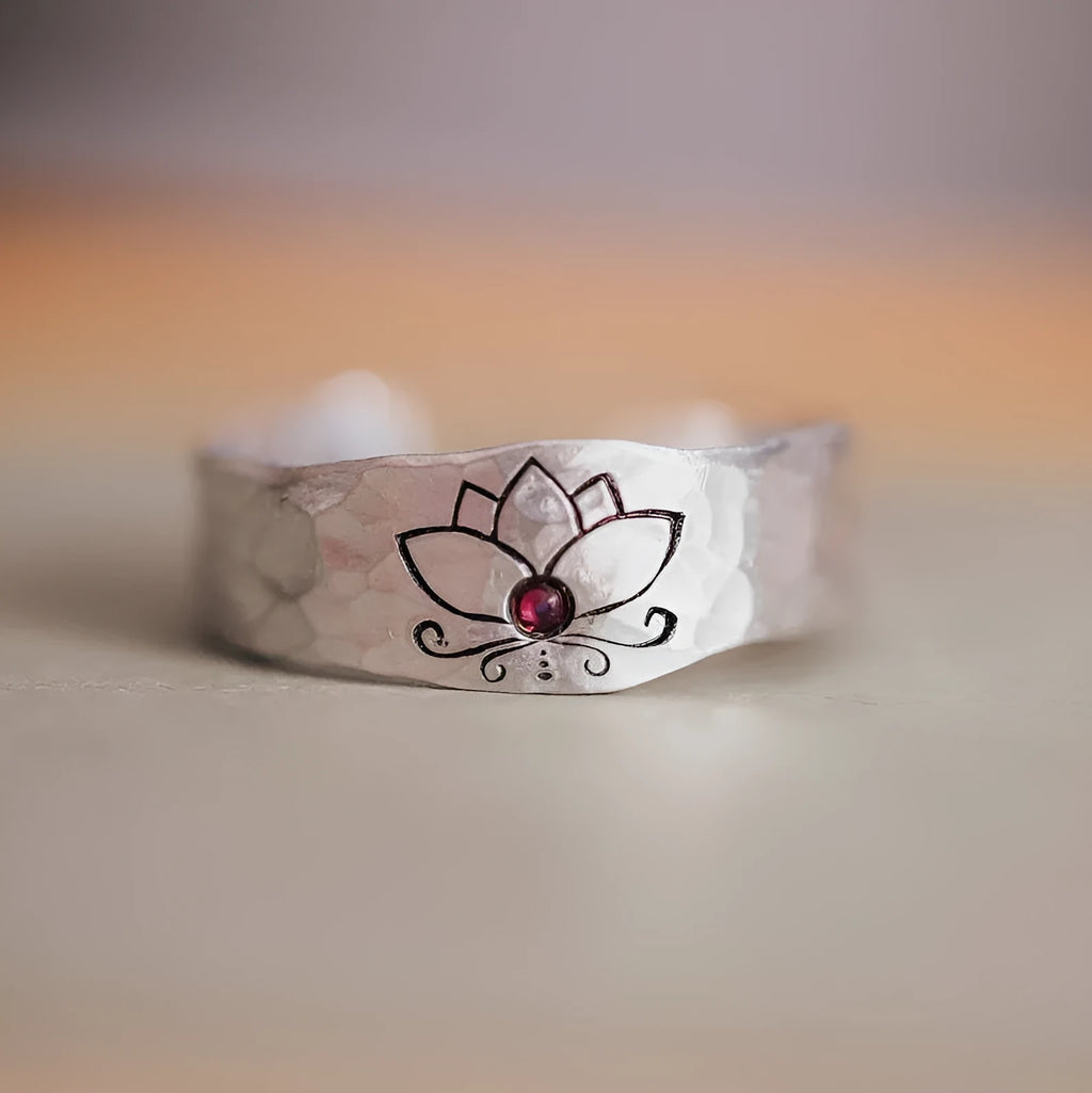 Silver alloy electroplated lotus ring on a light background, glossy finish, minimalist design