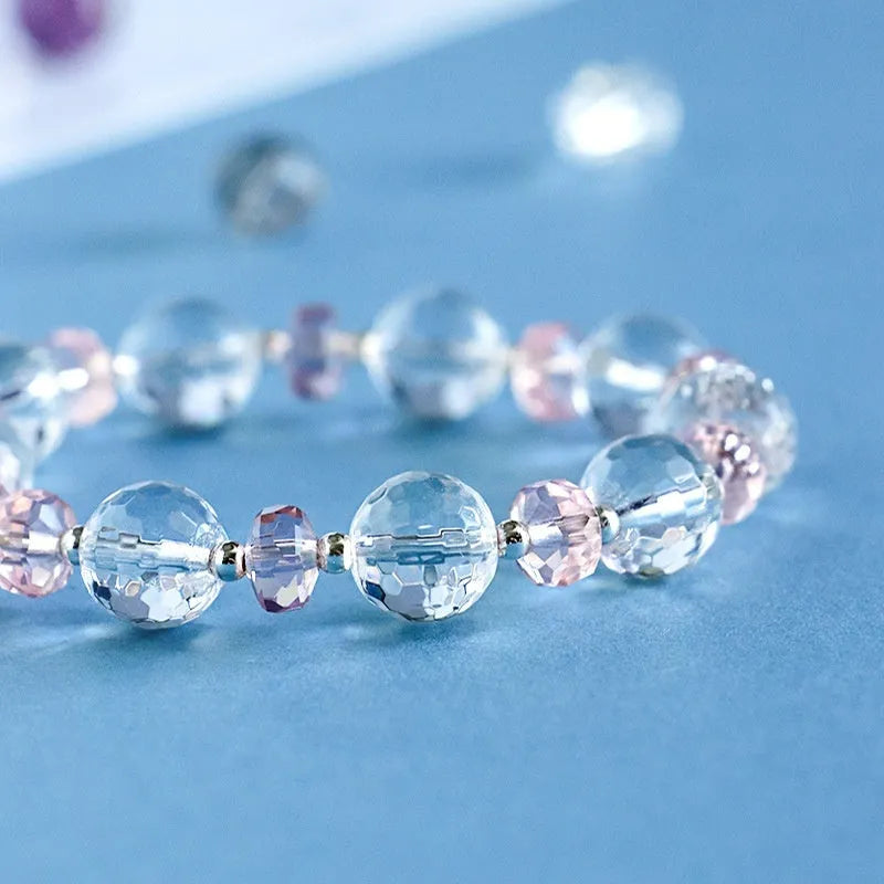 White crystal women's bracelet with diamond-shaped charms and lucky cat element on silver-tone chain