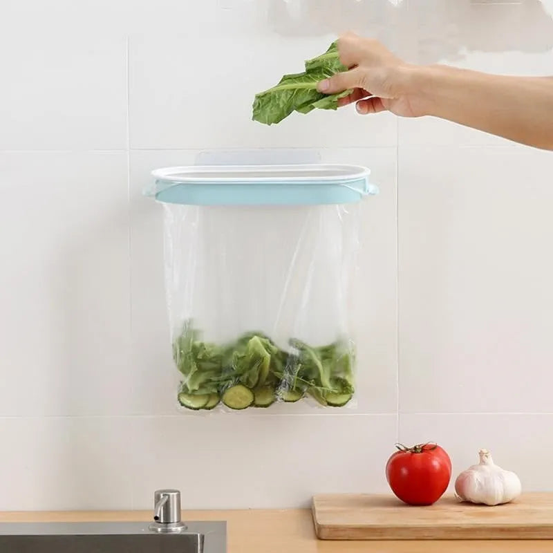 Blue or pink plastic kitchen garbage bag storage rack for mounting on cabinet or wall