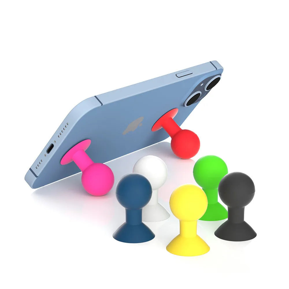 Creative silicone octopus ball mobile phone holder in blue on a desk with a smartphone inserted
