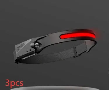 Black silicone rechargeable headlamp with LED lights, shown with wide beam and long-range illumination for outdoor use.