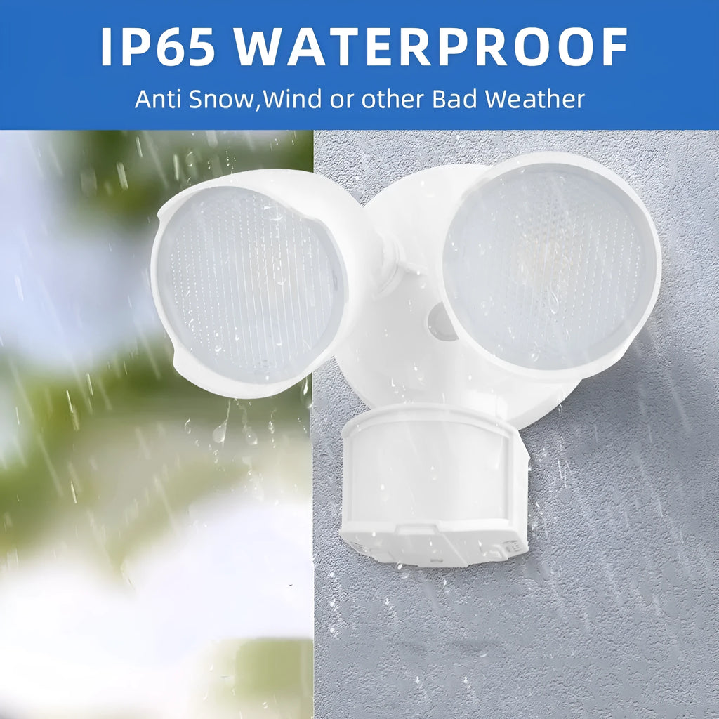 White outdoor LED security flood light with motion sensor mounted on a wall.
