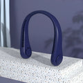 Blue portable bladeless neck fan hanging around a person's neck, showing its compact design.