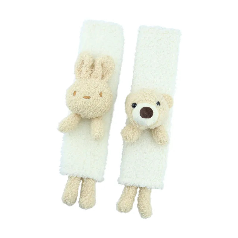 Cartoon plush lamb's wool shoulder protector for car seat belt in rabbit and bear designs.