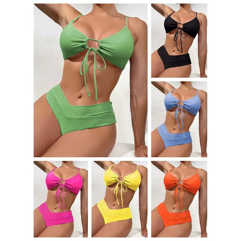 Women's orange tied bow bikini with halter neck top and high-cut briefs on mannequin