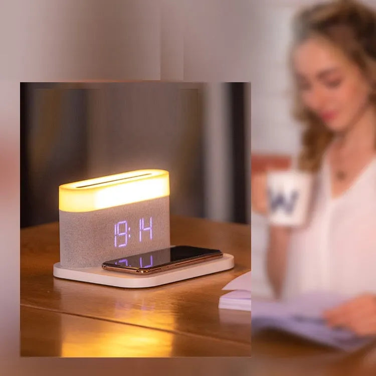 White or black table lamp with integrated wireless phone charger and digital clock display