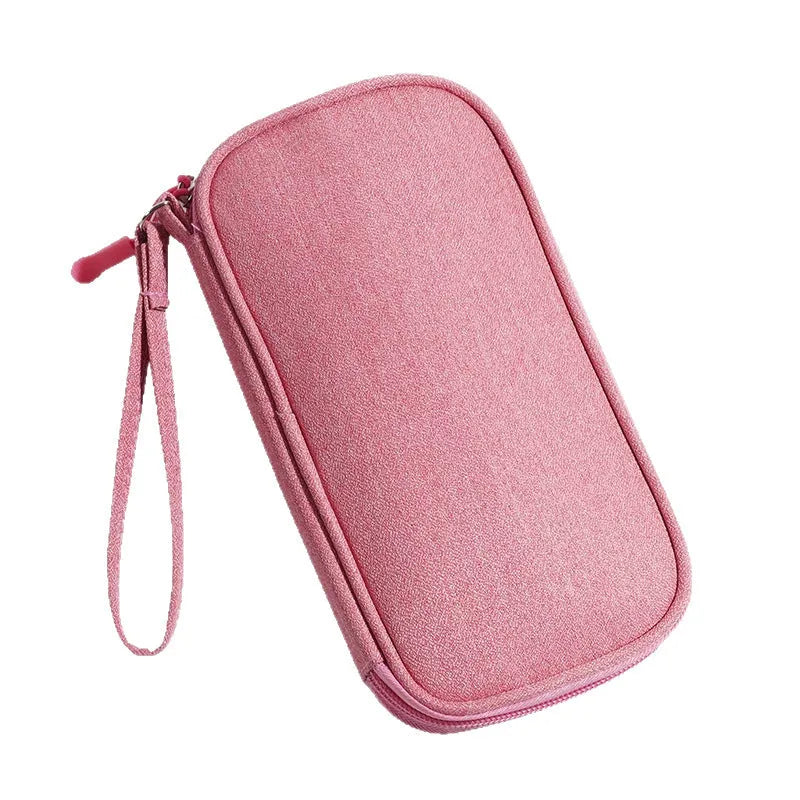 Portable data cable buggy bag in light gray, handbag style, 19x11x3 cm, on flat surface