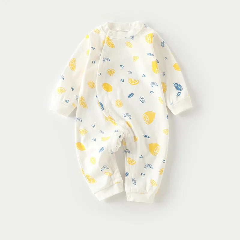 Infant in long climb style cotton pajamas with cartoon dragon print, Class A fabric.