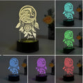 Modern acrylic dream catcher table lamp with colourful LED lights and a remote control on a wooden surface.