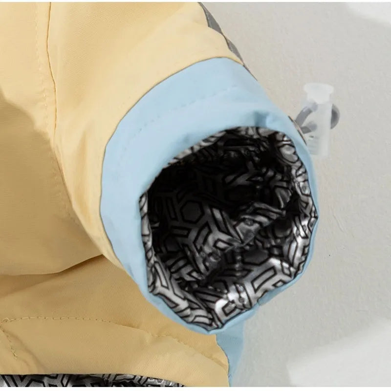 Xidao Di two-legged dog windbreaker coat in sunny yellow-blue colour on a small dog, with adjustable drawstring and D-ring.
