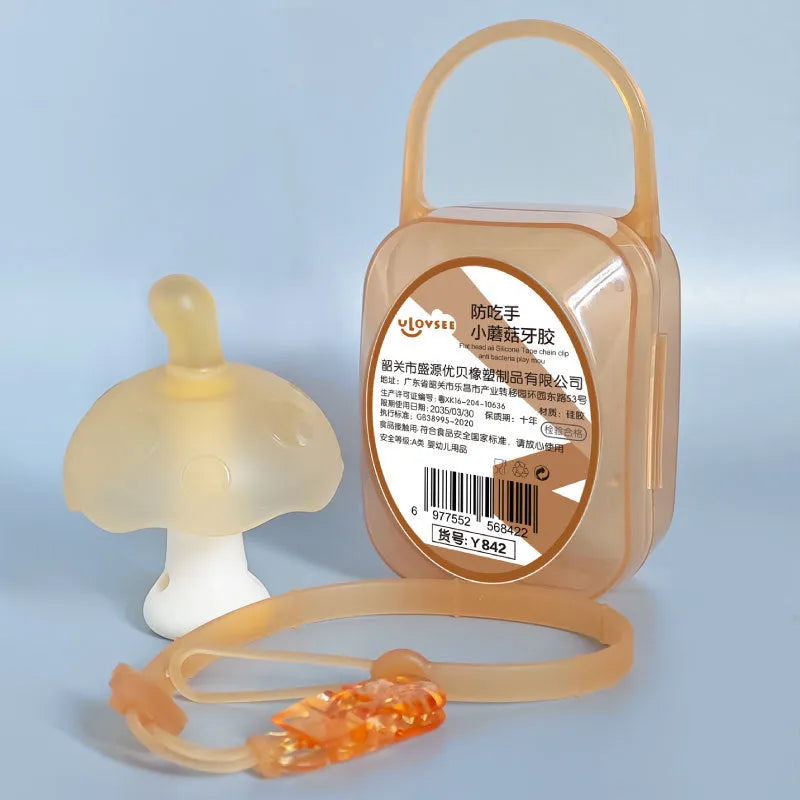 Small mushroom-shaped gum chewy toy in pink or nano colour, shown with transparent display box and optional chain.