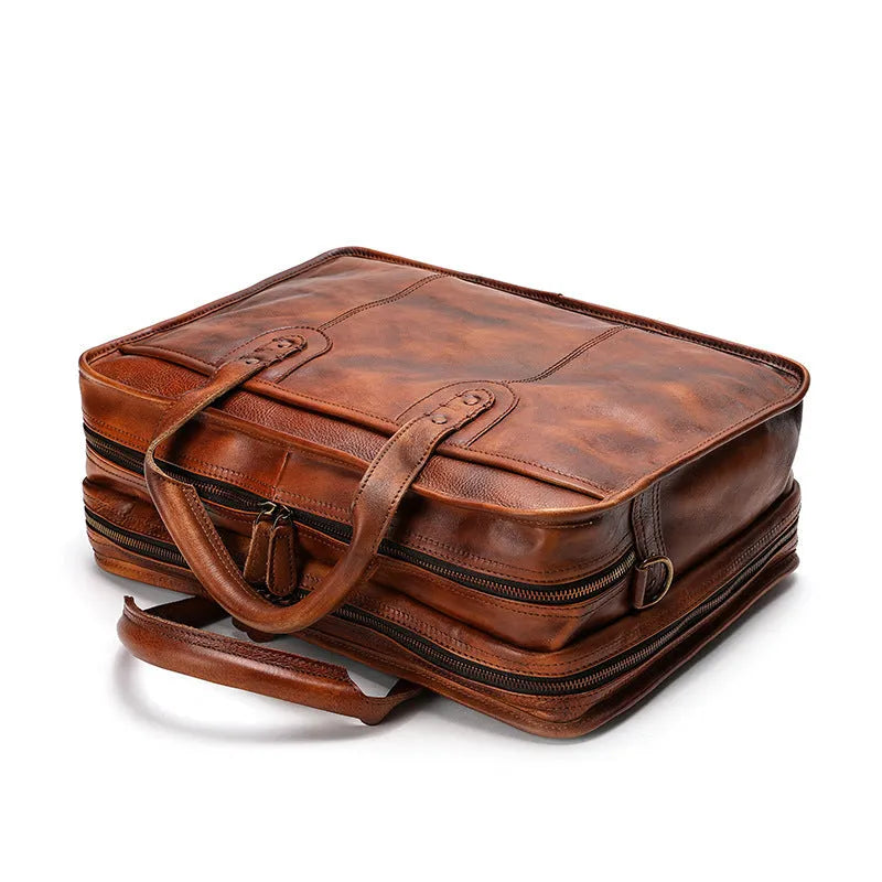 Black top grain cowhide leather men's briefcase showing its horizontal square shape and internal organiser pockets.
