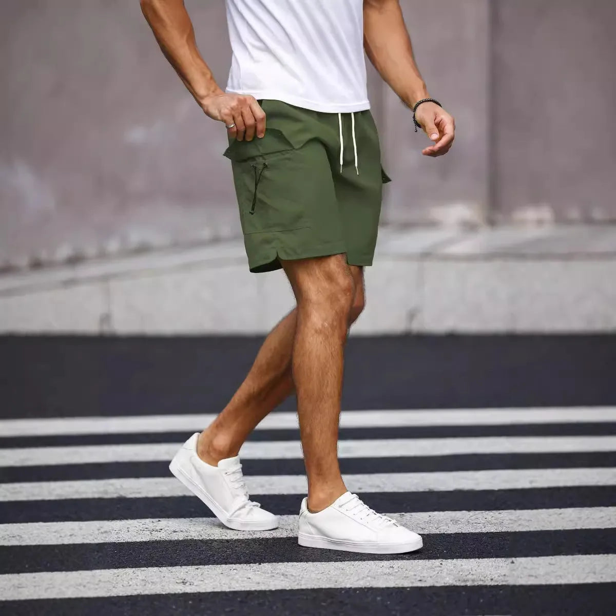 Men's loose fit workwear shorts in fluorescent green with straight leg cut and fifth pants length