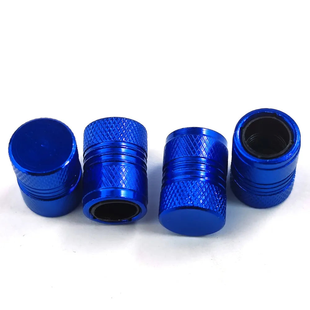 Aluminium car tyre valve cover in black, 17mm length, on a tyre valve stem