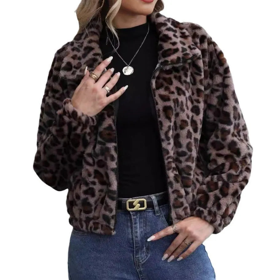 A woman's loose long-sleeve zip-up coat in a plush leopard print fabric with raglan sleeves.