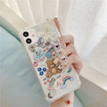 Bear chain and pendant attached to a Japanese Korean cartoon style protective case for an iPhone.