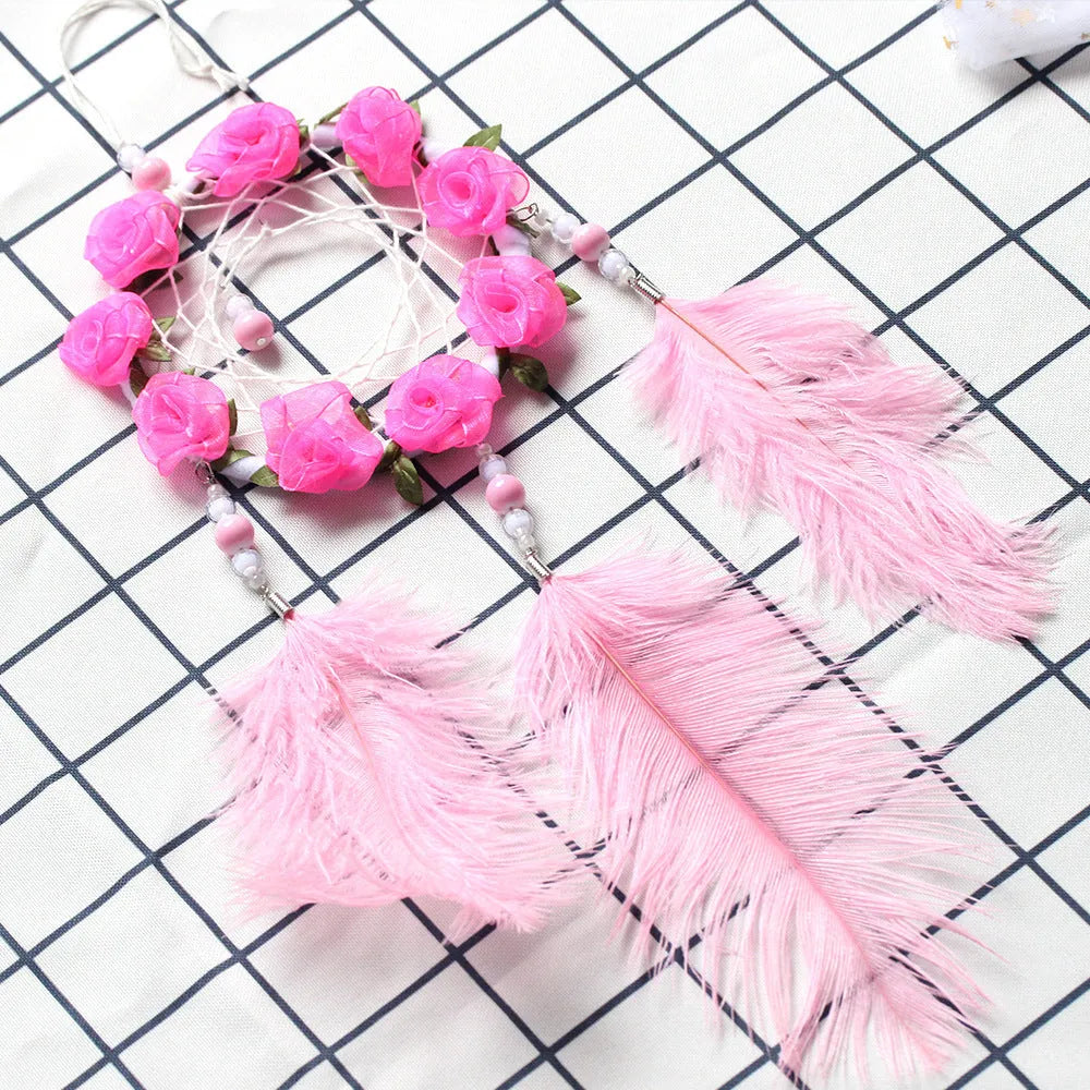 Pink ostrich feather dreamcatcher wind chime wall ornament measuring 10cm