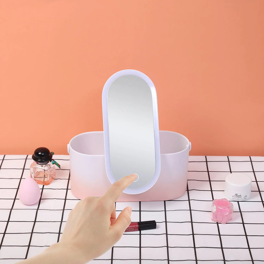 Pink gradient portable makeup storage box with built-in LED mirror, showing USB port and compact dimensions.