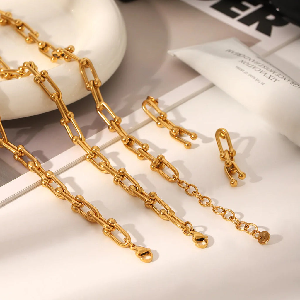 Stainless steel horseshoe chain jewellery set with necklace, bracelet and earrings featuring titanium steel pendants