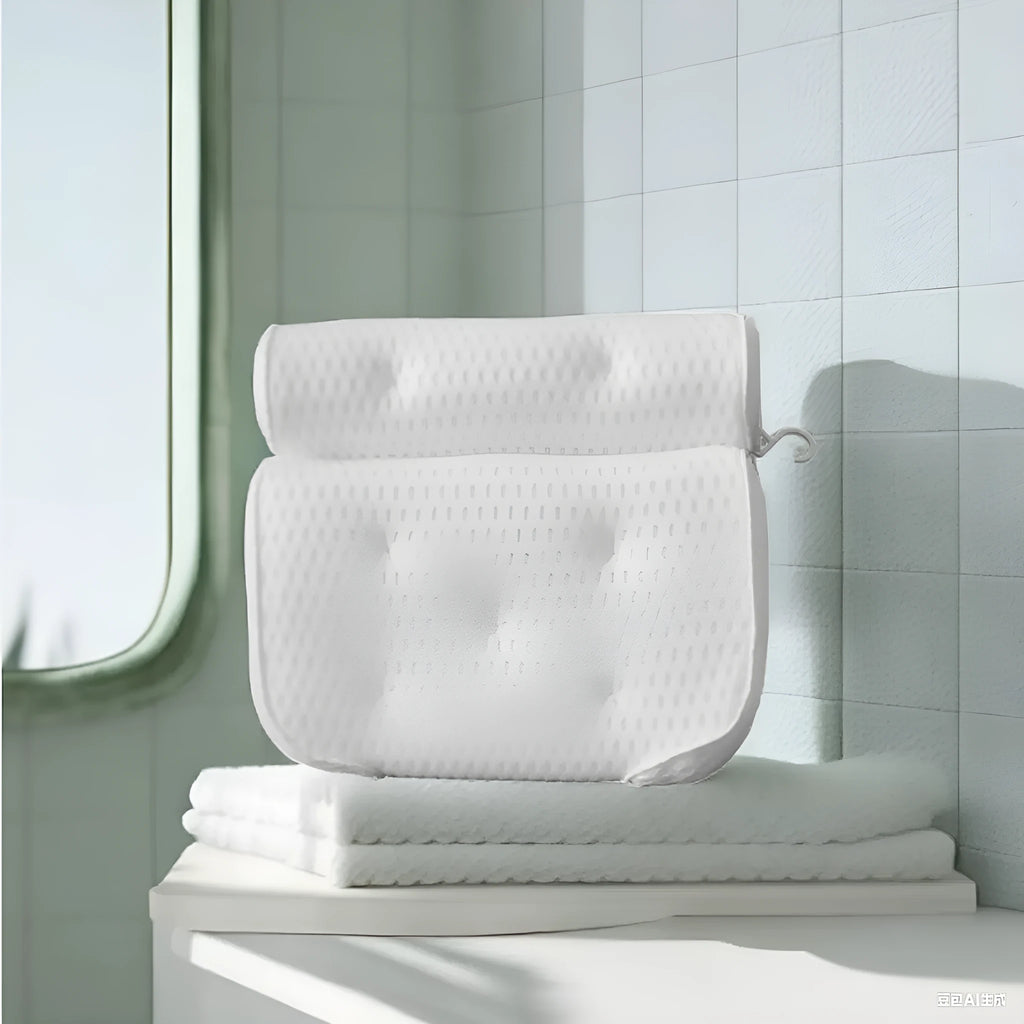 White 4D mesh bathtub pillow with suction cups on a bathtub