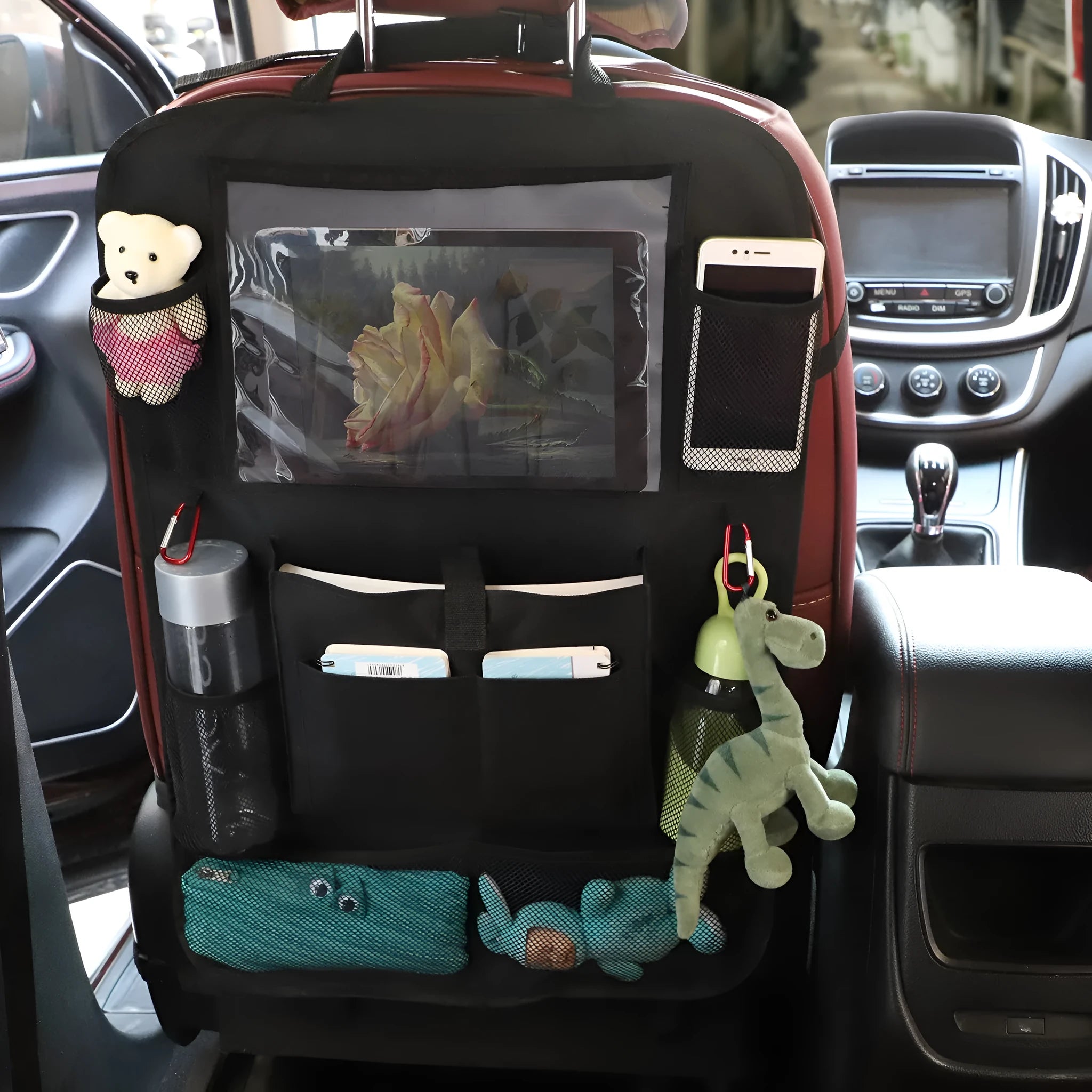 Black universal car organiser hanging storage bag with multiple pockets attached to car headrest