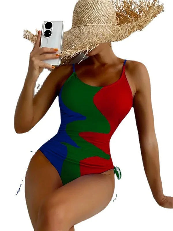 Women's blue one-piece swimsuit with sleeveless backless design and printed stripe pattern