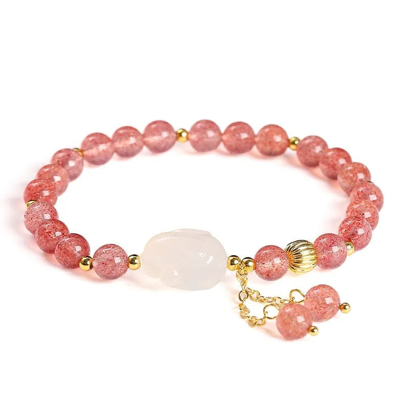 Women's strawberry quartz and agate bracelet with 6mm round beads and a white rabbit charm pendant.