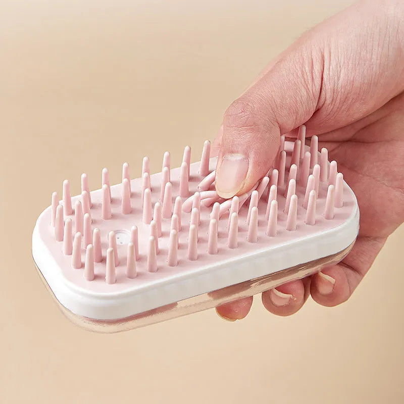 Grey and pink silicone bath massage brush for washing dogs and cats.