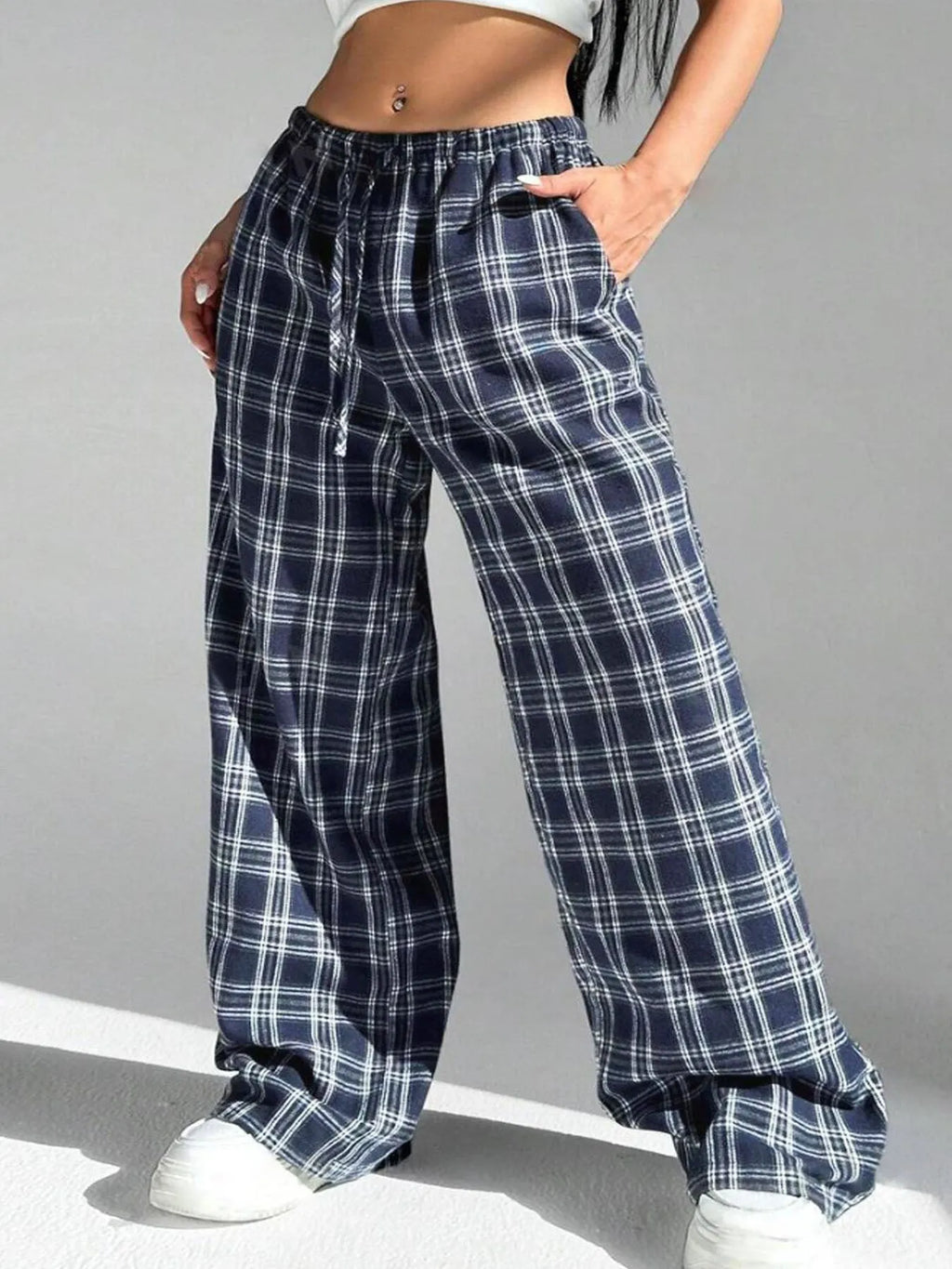 Women's plaid pattern casual trousers with loose fit, drawstring waist, and functional pockets