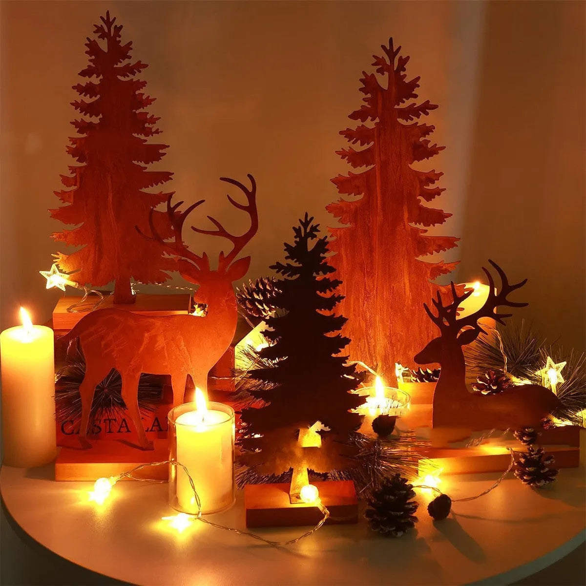 Set of three rusty iron Christmas tree decorations with standing elk figures