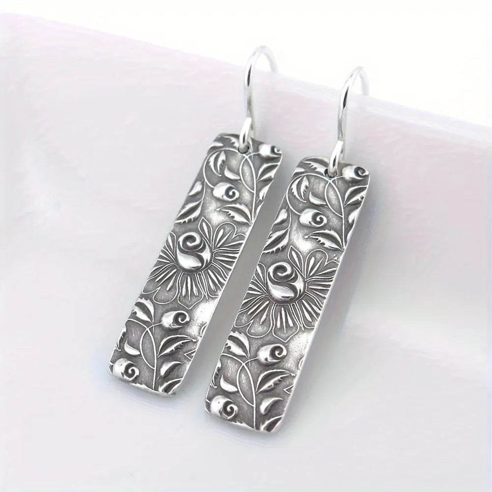 Silver geometric long earrings with carved vine patterns on zinc alloy
