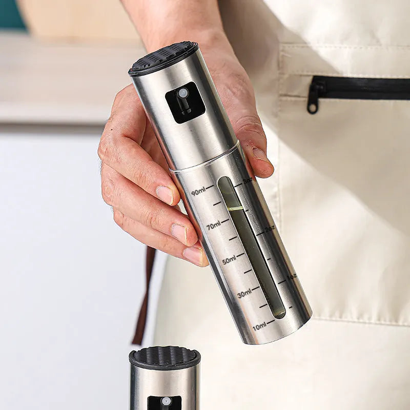 Stainless steel press type oil spray bottle with 100ml glass body and visual scale