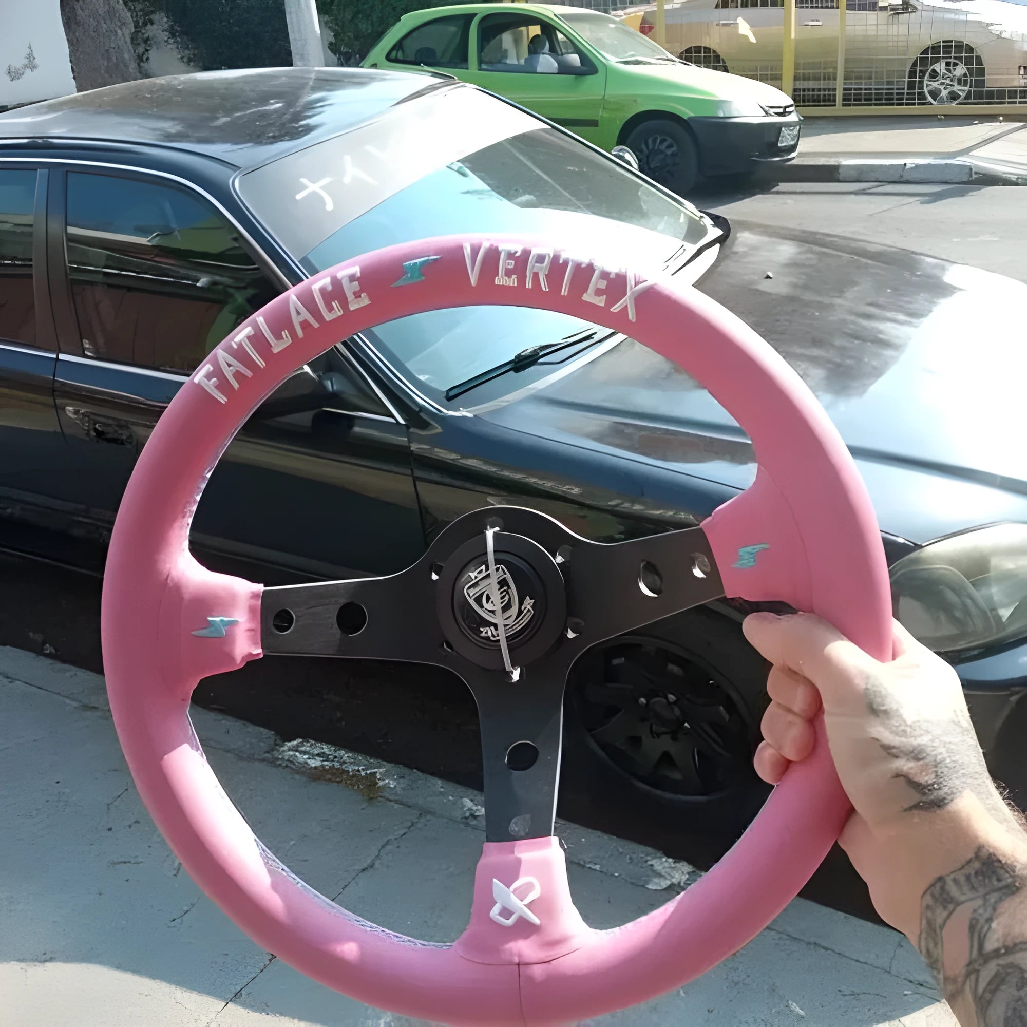 Pink leather 13-inch steering wheel with universal Lightning connector and aluminum bracket.