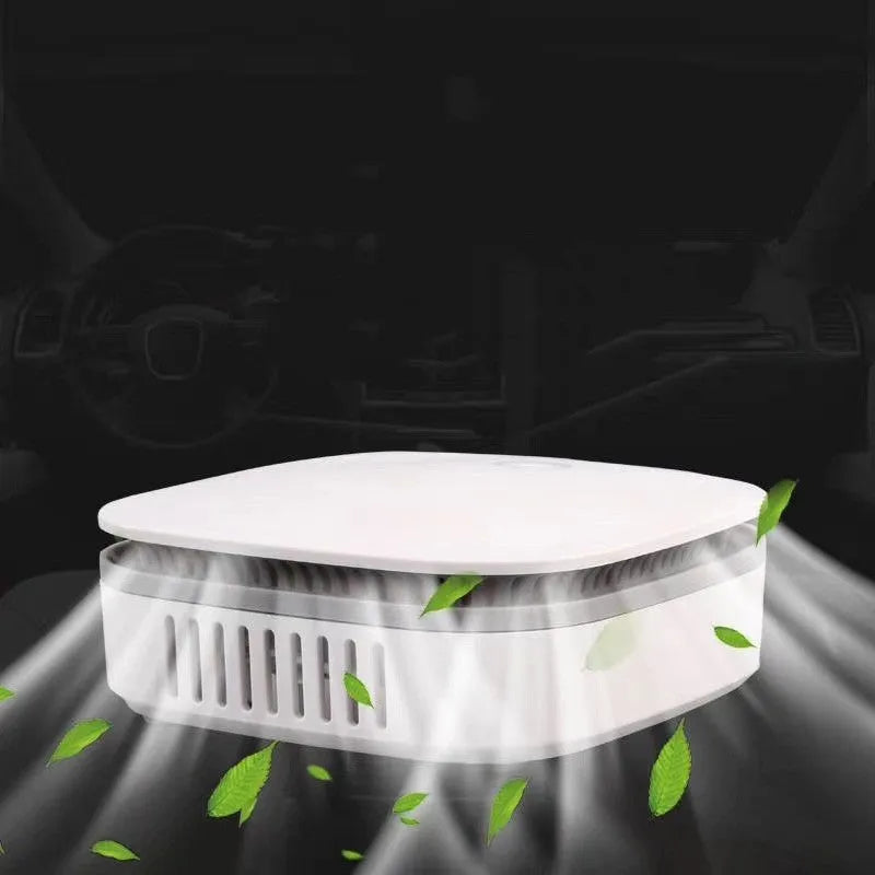 White portable USB air purifier with button control for car and small room use.