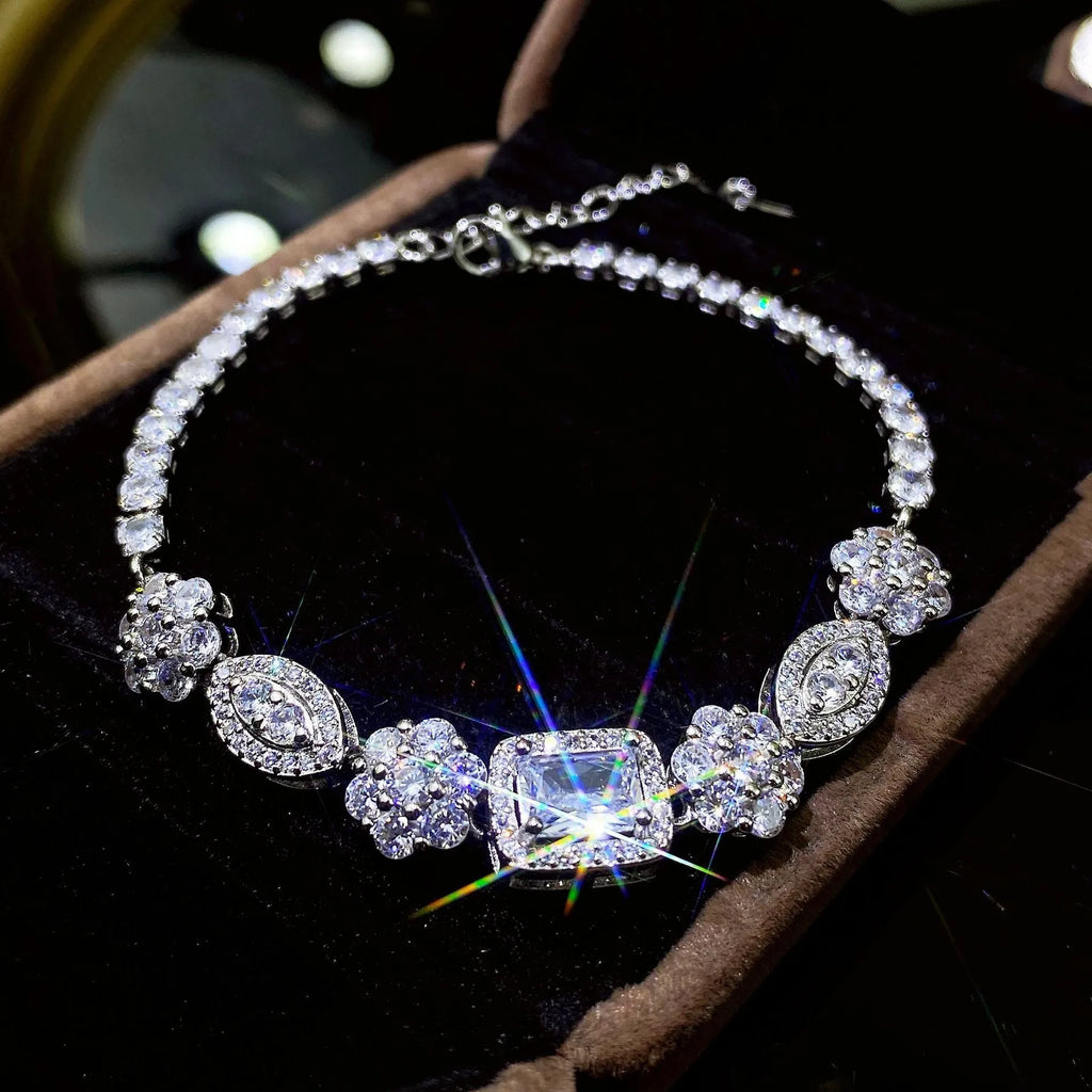 Geometric women's silver bracelet with zircon stones, shown in two length options.
