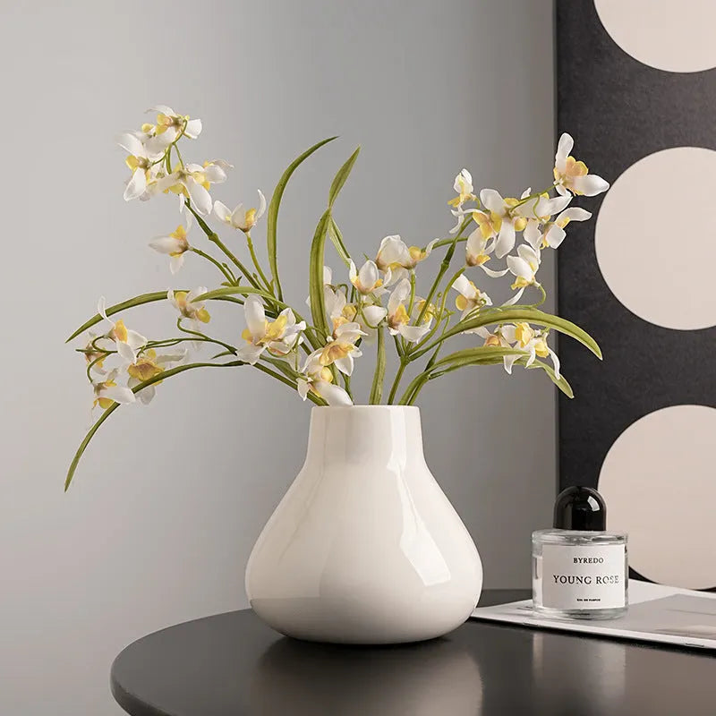 Round belly ceramic vase in black or white with optional artificial flowers arrangement