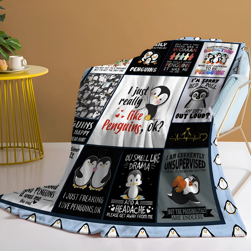 Multicolored flannel velvet blanket with penguin patterns, 130x150cm, on a sofa