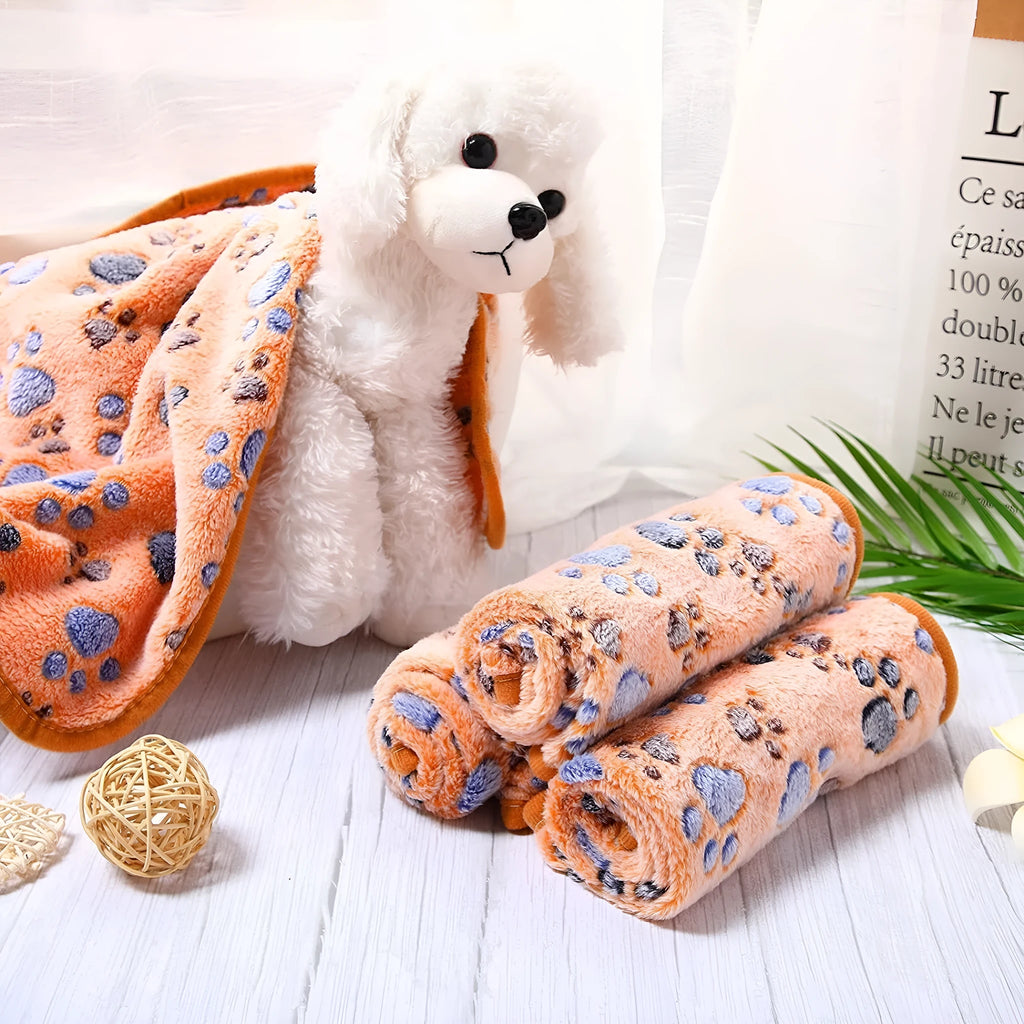 Coral fleece dog blanket with dog's paw pattern in selected colour and size