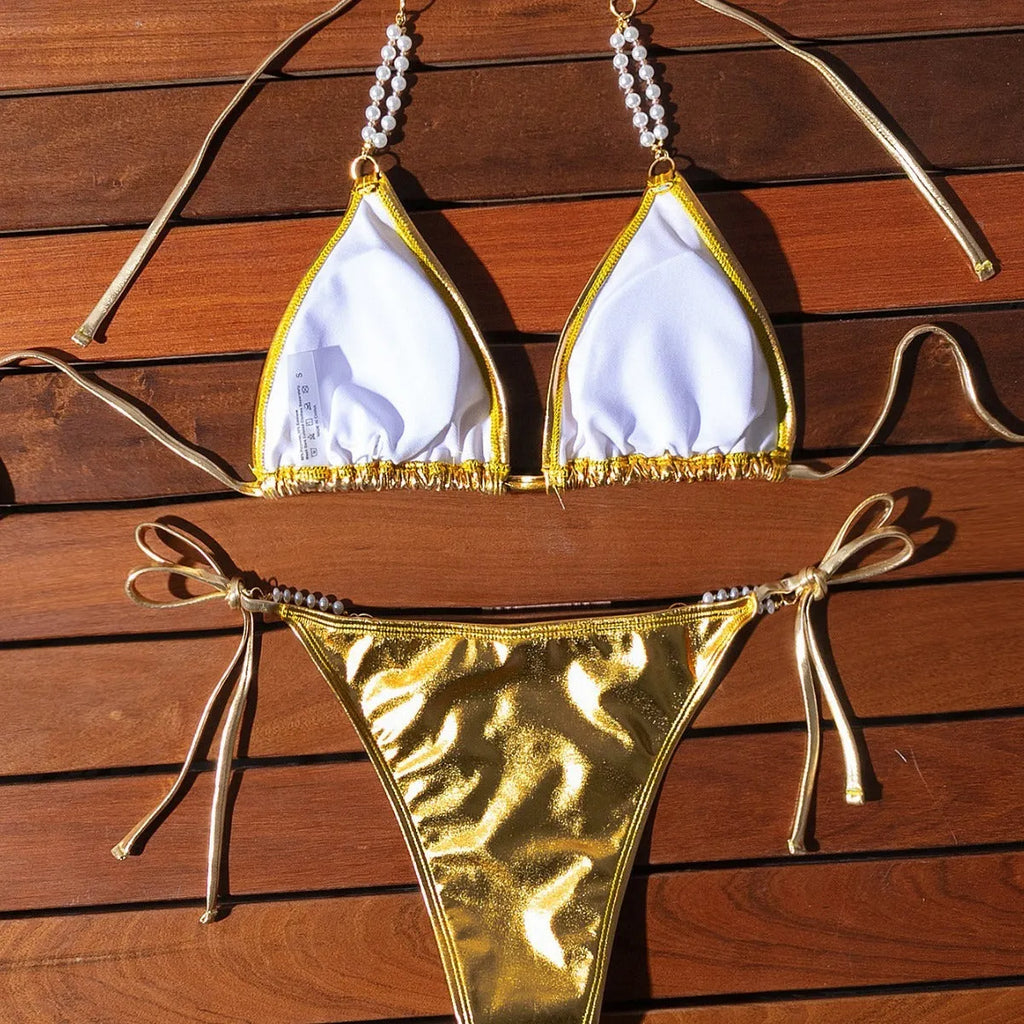 Gold halter lace-up bikini swimsuit with pearl chain fastening on the back