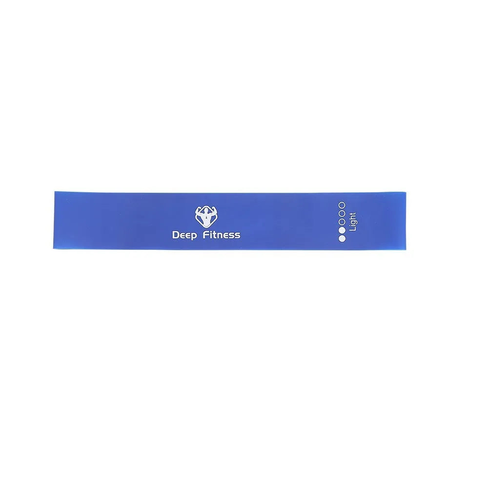Yoga hip resistance band set in six colours from 0.4mm green to 1.2mm black laid flat on a surface