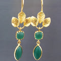 Gold-colour drop-shaped earrings with French leaves tassel design and small zircon stones.
