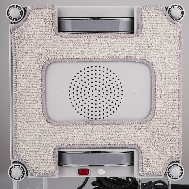 White intelligent window cleaning robot for automated high-rise window washing.