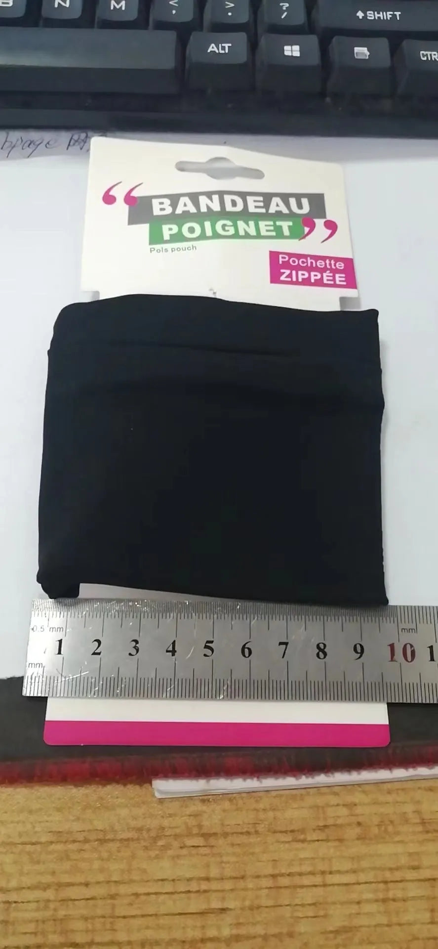 Compact 10 by 10.5cm wrist-worn armband sleeve for carrying a mobile phone.