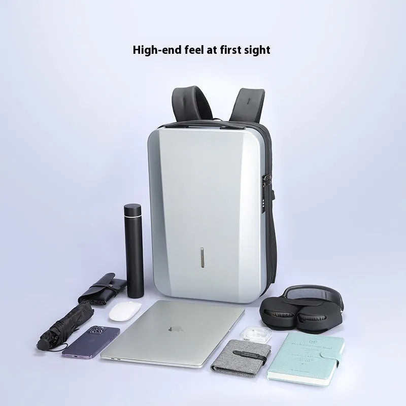 Anti-theft 17.3-inch laptop backpack with ABS hard shell, USB interface, and curved shoulder straps in Deep Space Black