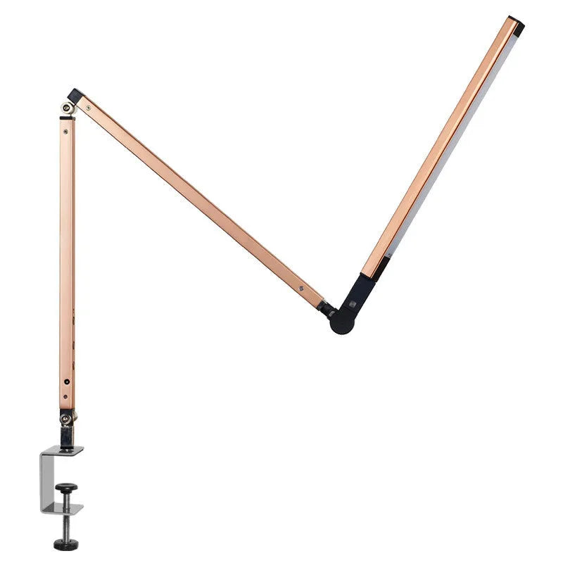 Aluminum clip-on LED desk lamp with dimmer switch mounted on a desk edge.