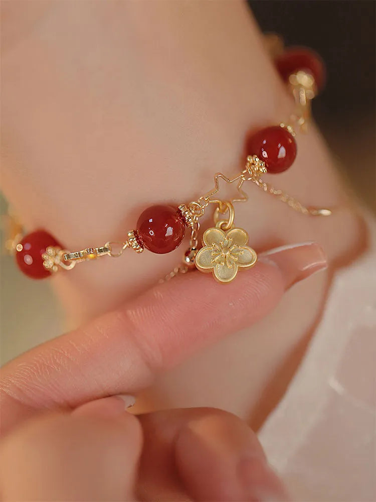 Women's red agate bracelet with double layer design and peach blossom floral elements